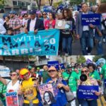 Cientos de dominicanos NYC acompañan congresista Espaillat en marcha apoyo a Kamala