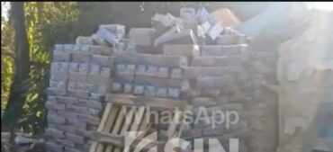 Descubren miles de cajas de leche del desayuno escolar tirados en vertedero improvisado en El Higüero; INABIE calla